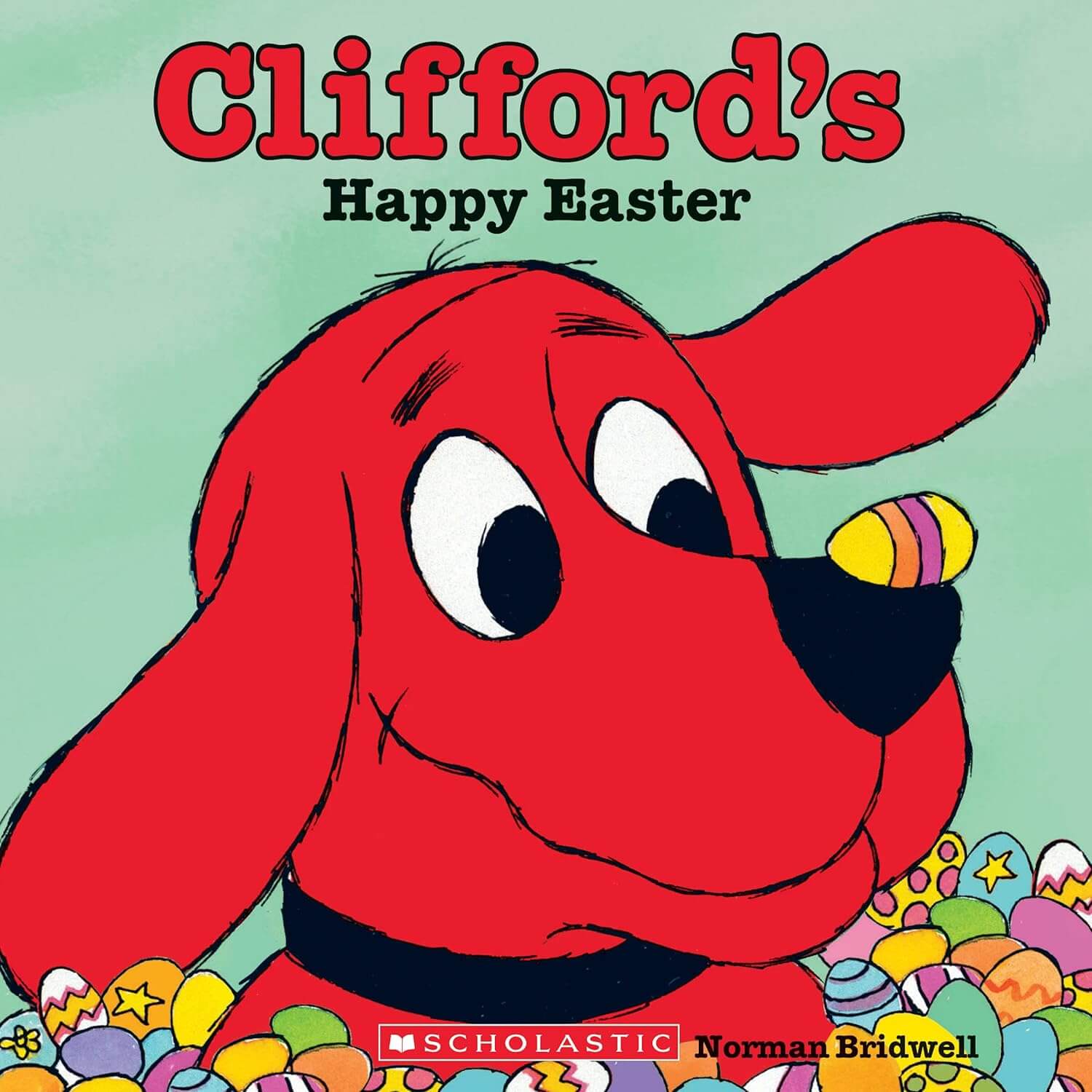 Clifford the big red dog with a painted easter egg on the tip of his nose